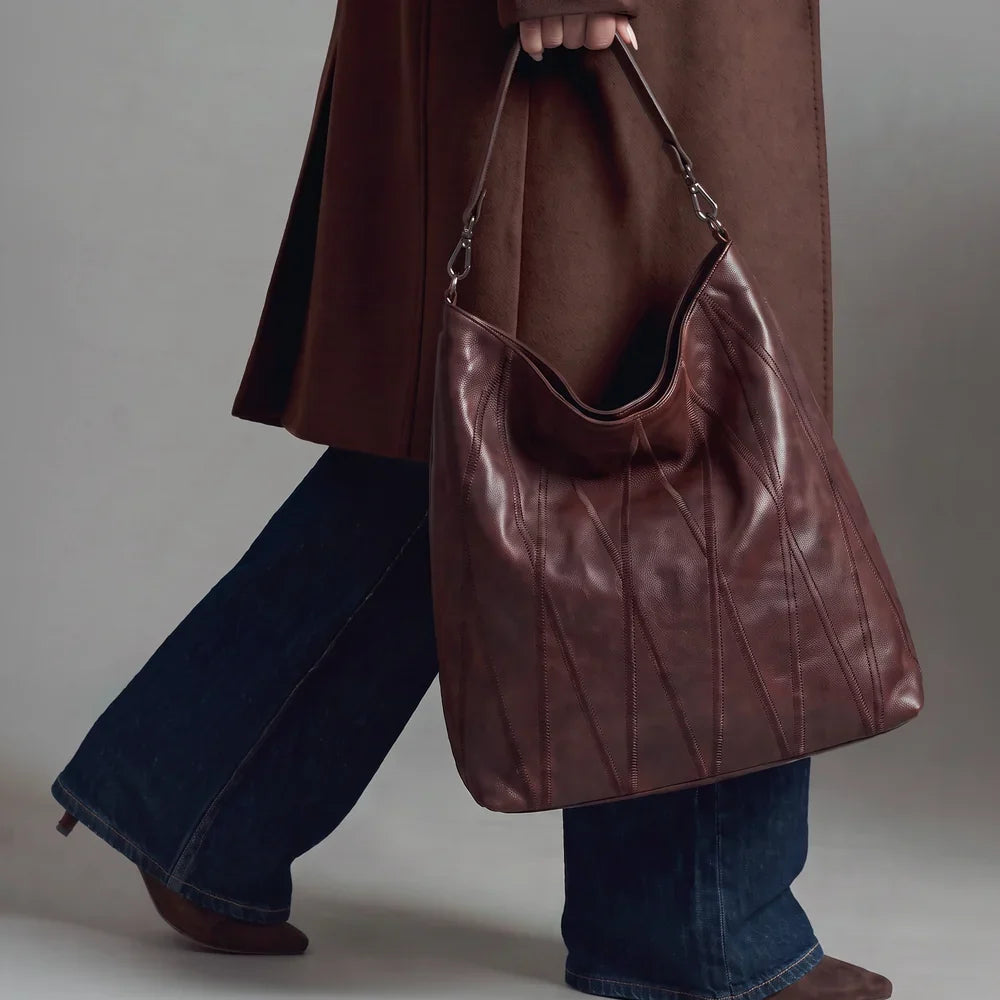 Woman carrying the brown Bree Diamond Leather Shoulder Bag by Latico Leathers