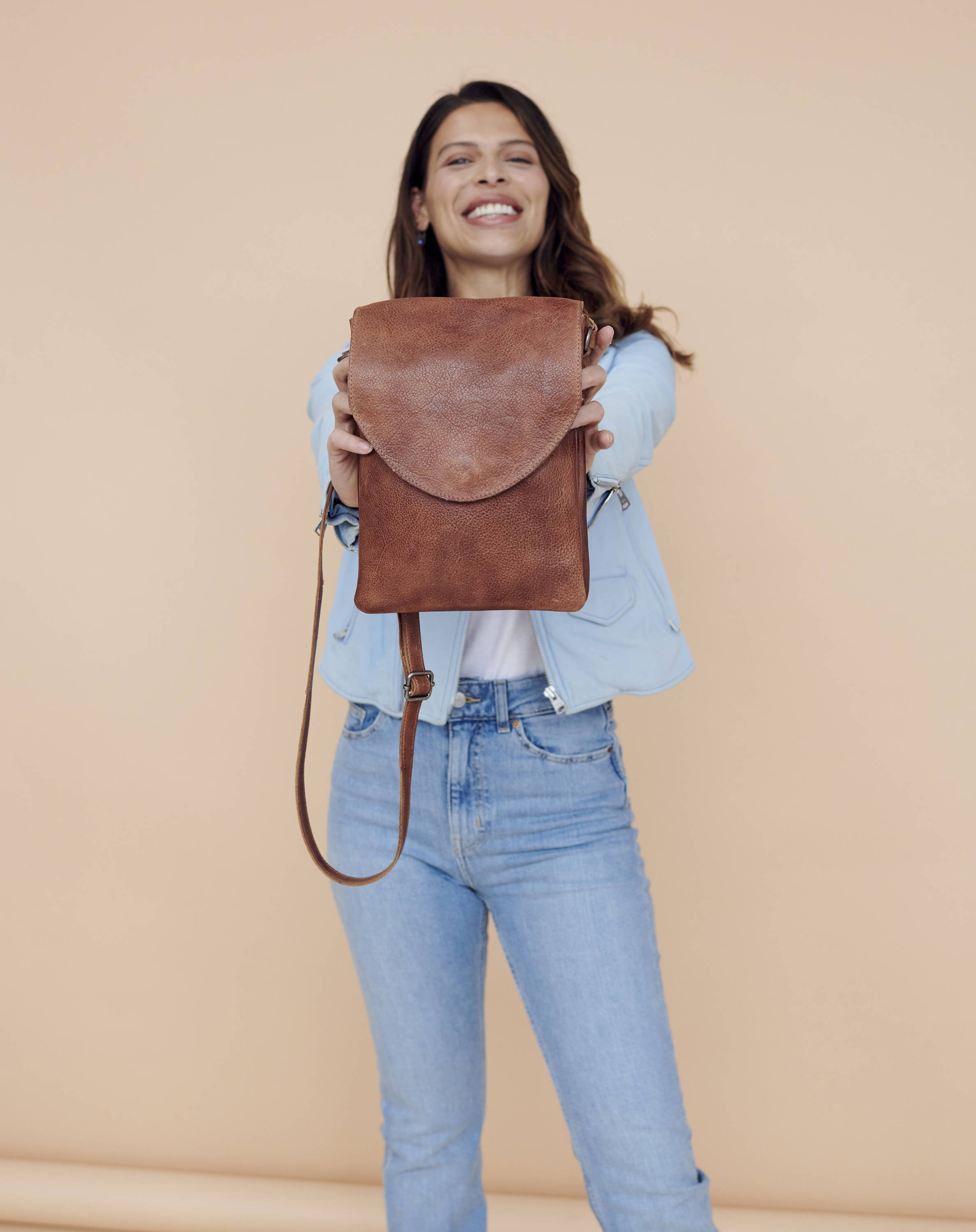 woman holding a high-quality leather bag