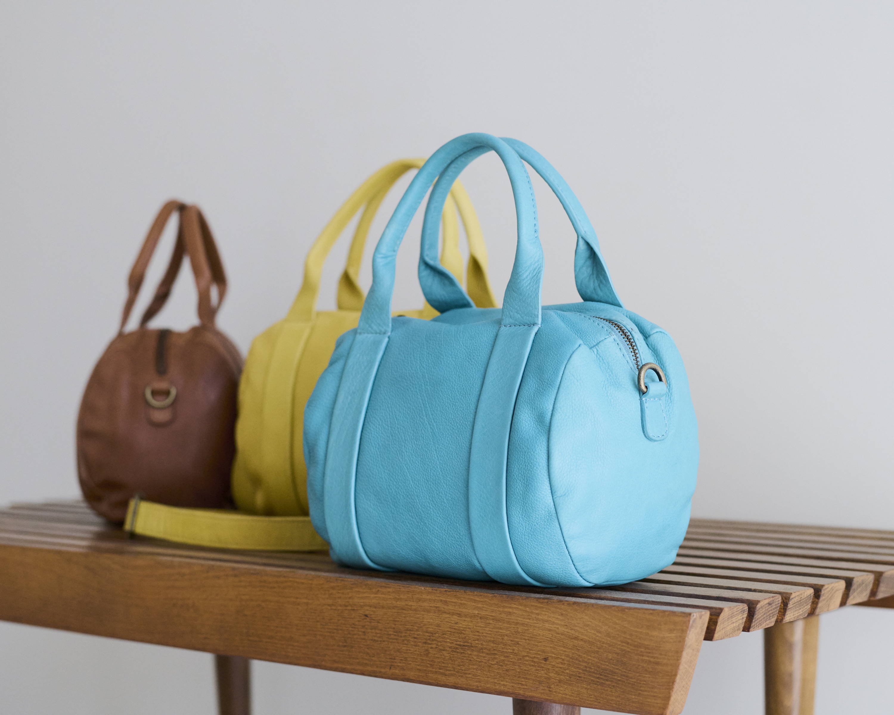 How to Style a Turquoise Leather Bag for Casual & Formal Looks