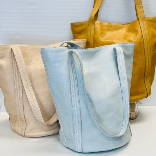 Sky Blue, camel, and rosa full-grain leather Kent tote bags by Latico Leathers