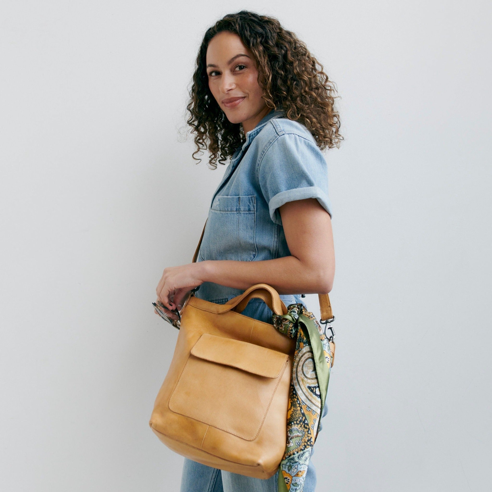 Camel full-grain leather Bianca tote crossbody bag on model by Latico Leathers