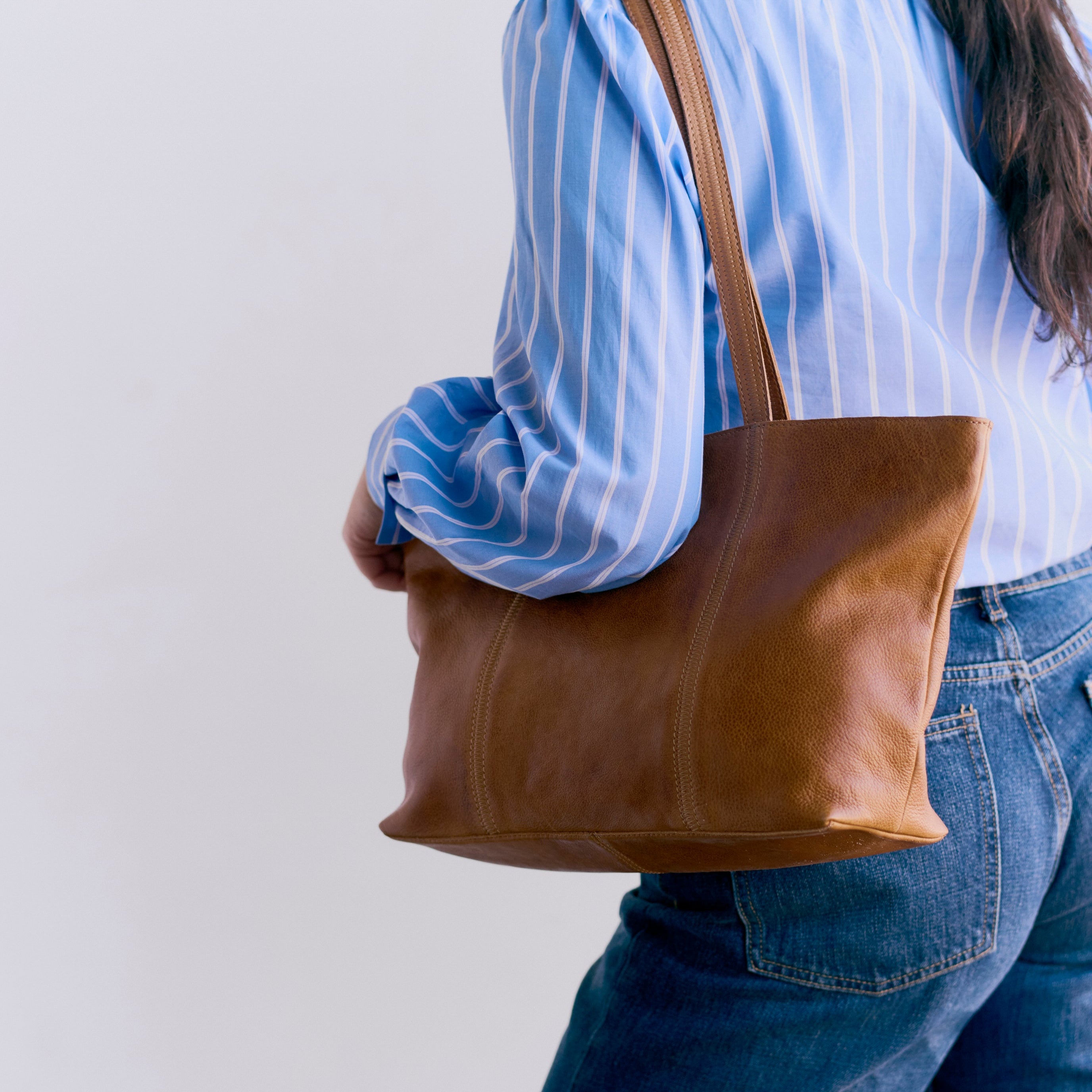 Cognac full-grain leather Margot tote bag on model by Latico Leathers