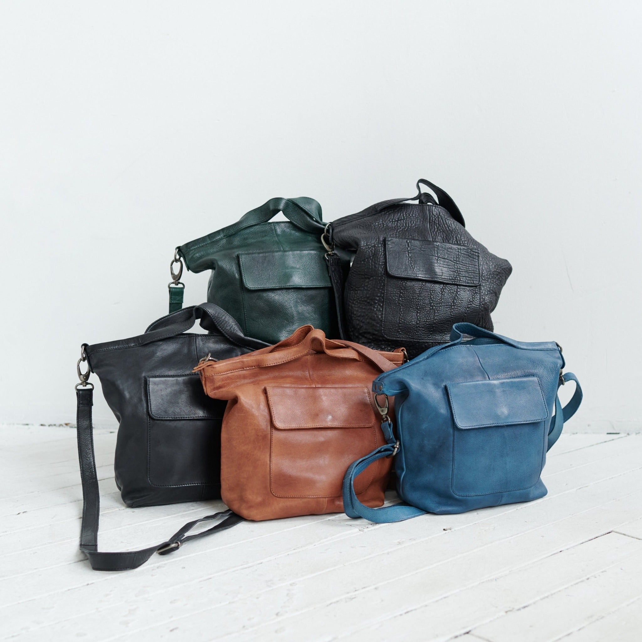 Denim, black, bubble black, and cognac full-grain leather Bianca tote crossbody bags by Latico Leathers