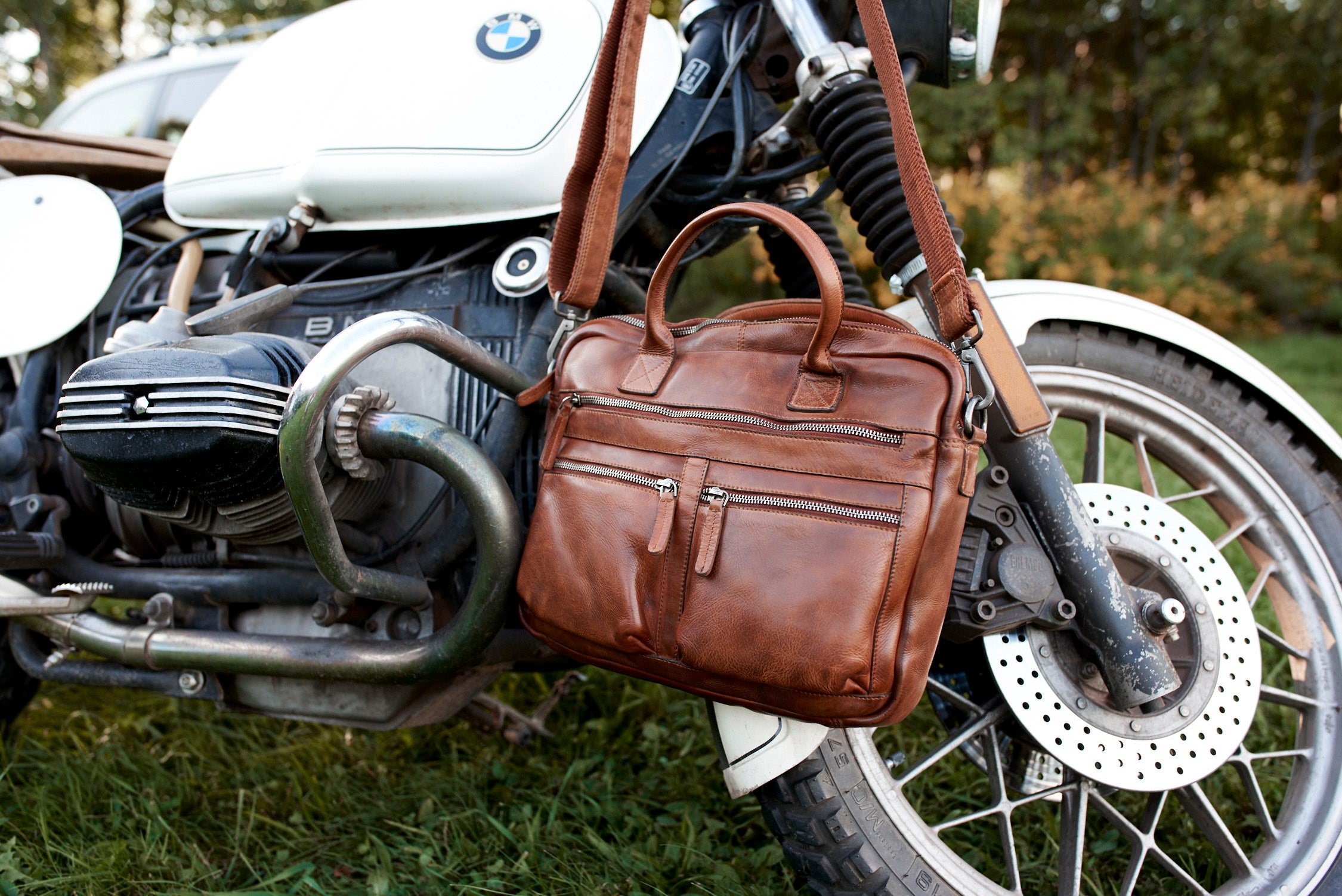 leather laptop case on motorcycle