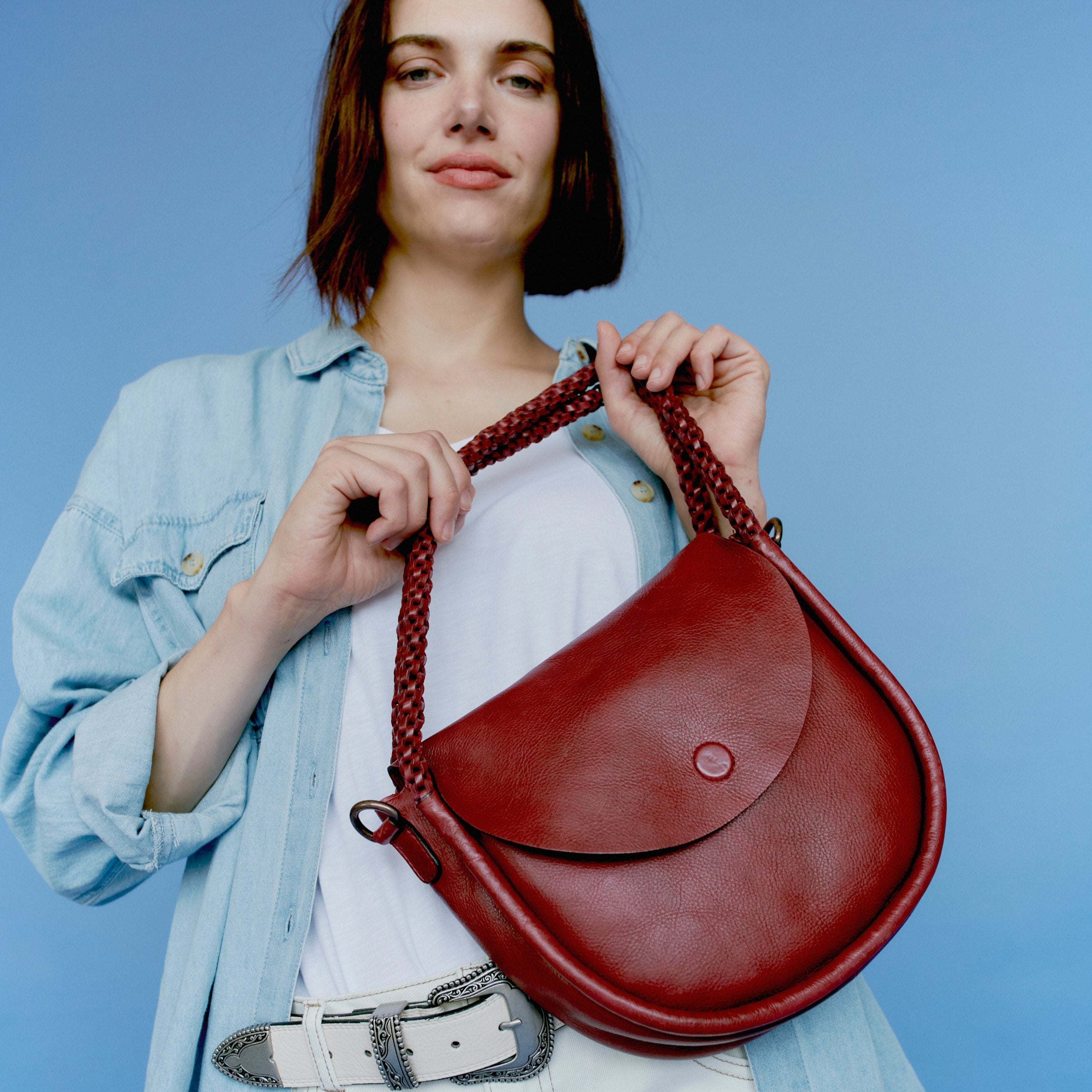 Burgundy full-grain leather Portage crossbody shoulder bag on model by Latico Leathers 