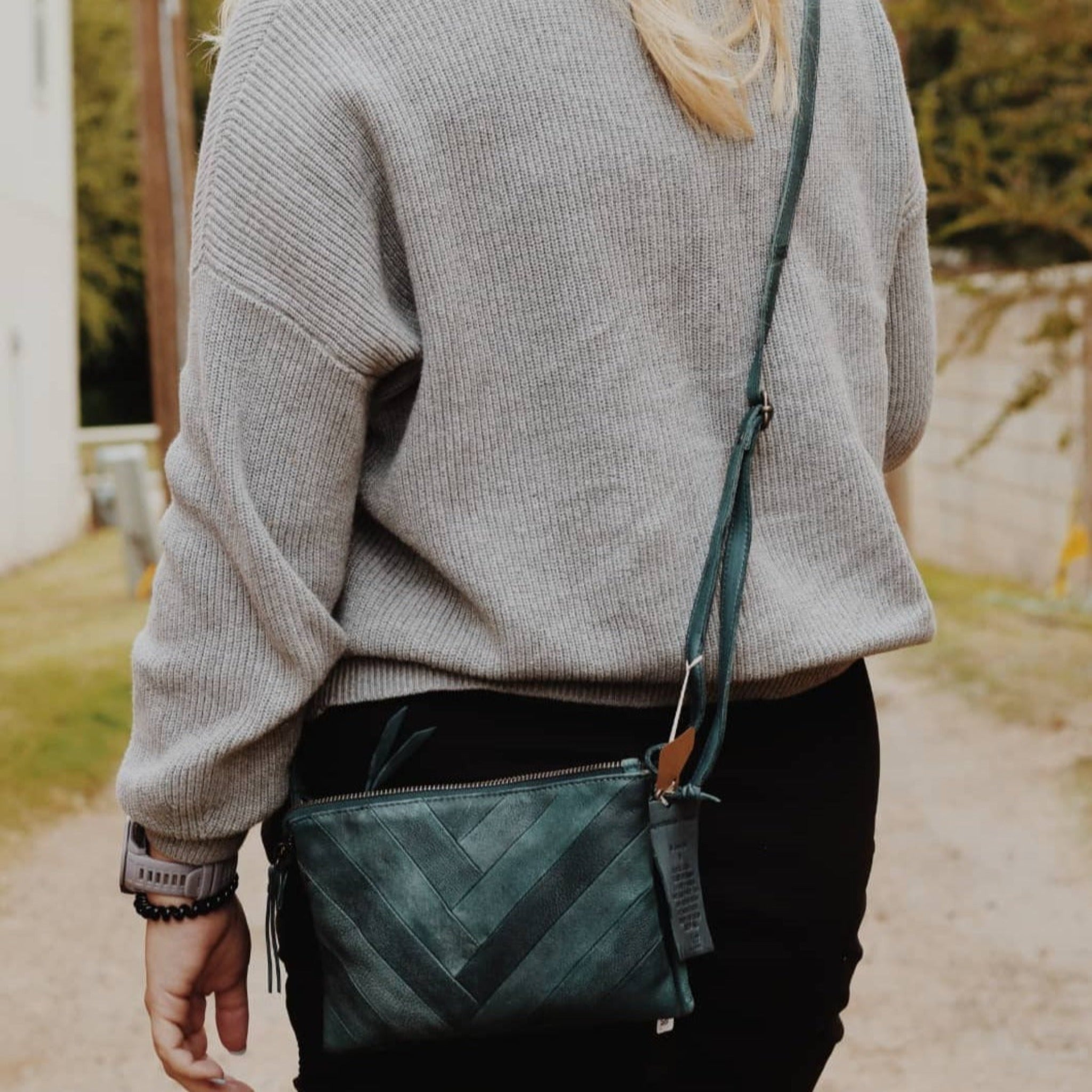 Hunter full-grain leather Sunny crossbody bag on model by Latico Leathers
